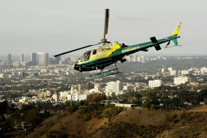 Image of a sheriff's helicopter flying over Los Angeles.