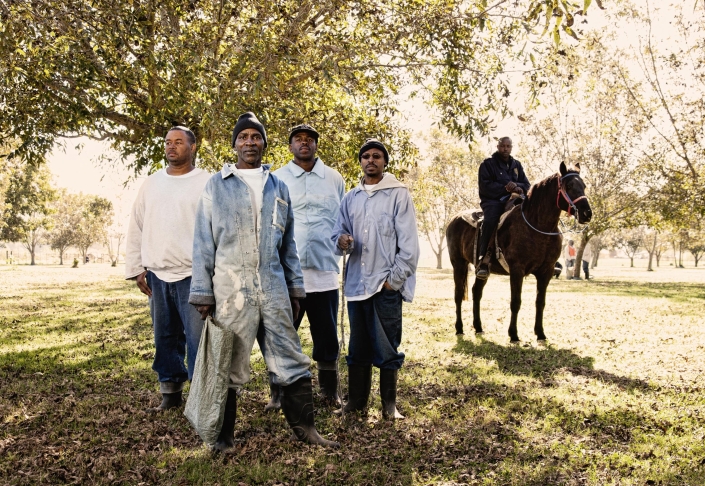 Jimmy Jackson (front), 63, in the Pecan Field at Angola, a notorious maximum-security prison near St. Francisville, Louisiana